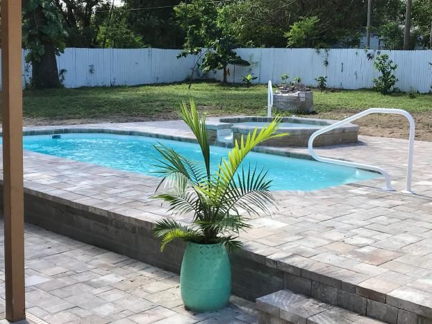 After a completed fiberglass pools installers project in Spring Hill, FL by Trinity Pools, Inc.