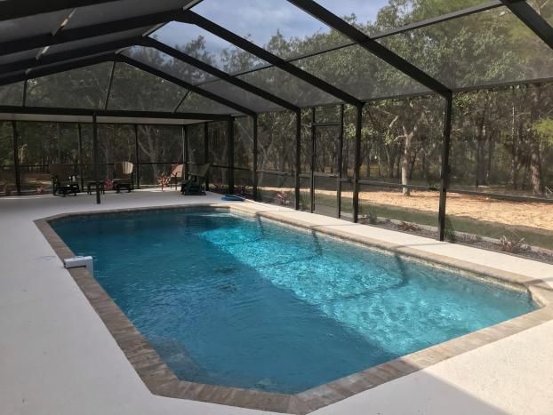 Inground pool installation in Spring Hill, FL by Trinity Pools, Inc.