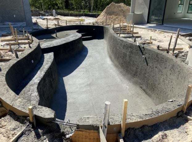During an inground pool installation by Trinity Pools, Inc. in Spring Hill, FL